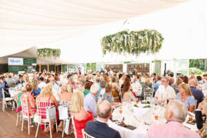 An image that shows the set up of the inside of the main marquee at Berry's tennis event.