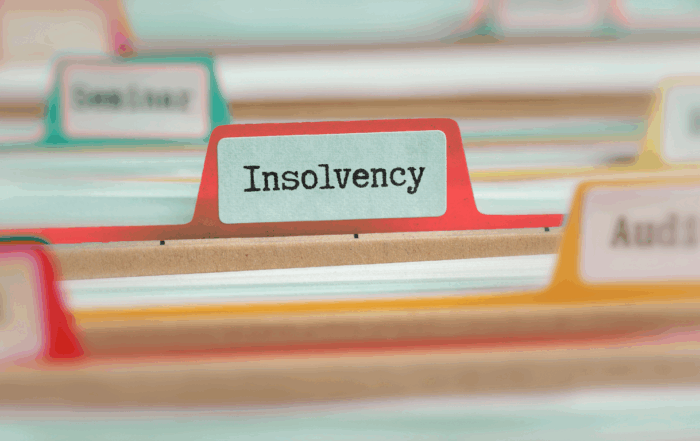An image of a drawer of files with one being named 'insolvency'.
