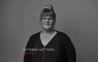 A black and white image of Kaye with the writing "October Hot Topic" in white and "Fire Risk" in red.