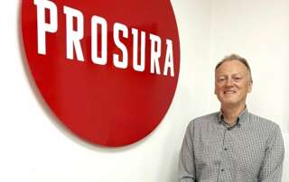 Eddie Hodgson is pictured in front of a Prosura logo.