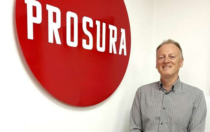 Eddie Hodgson is pictured in front of a Prosura logo.